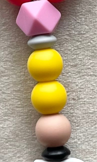 Rainbow wristlet keychain for teachers made with silicone beads made to look like a #2 pencil. "Coffee Teach Repeat" saying focal bead. RoyGBiv