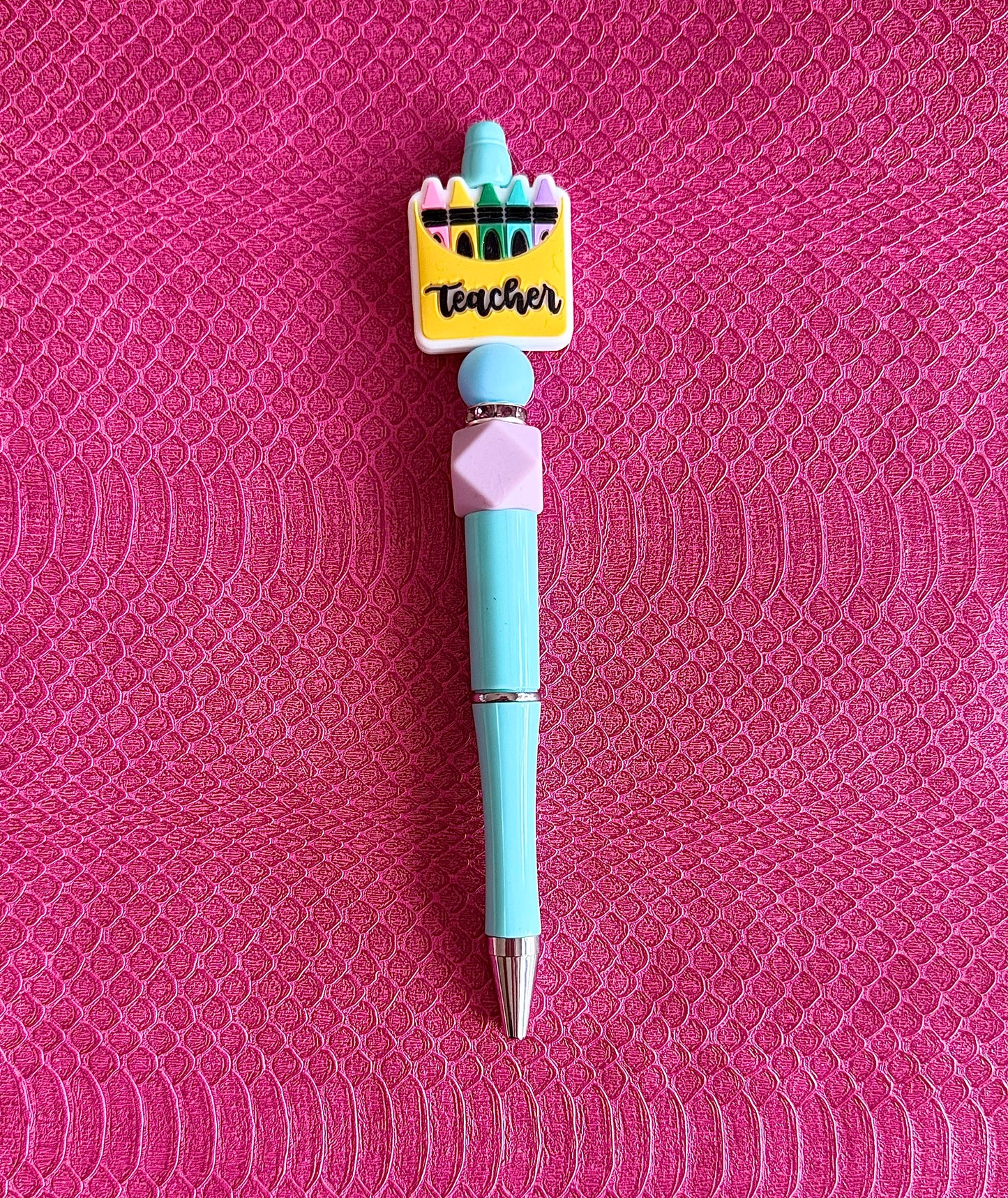 Light Blue Pen with a colorful teacher-themed top in shape of a crayon box with 'Teacher' text silicone focal bead